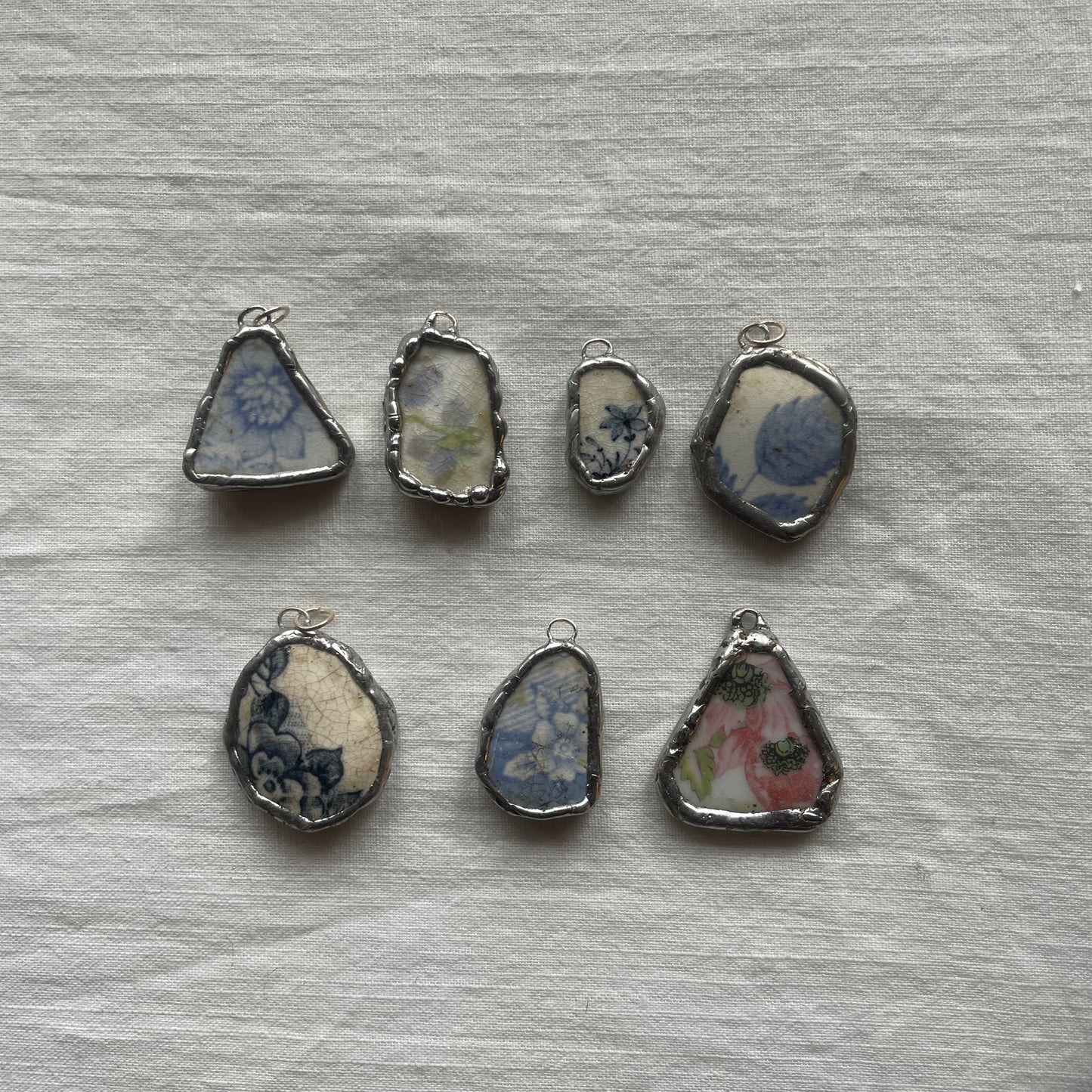 Sea pottery and silver pendant floral designs