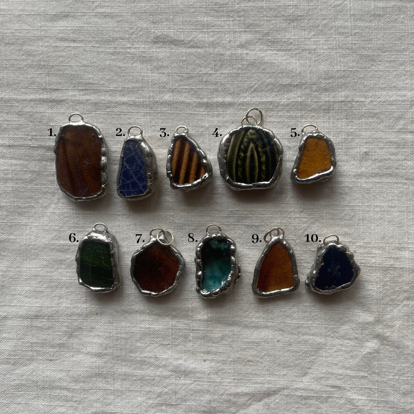 Sea pottery and silver pendant dark