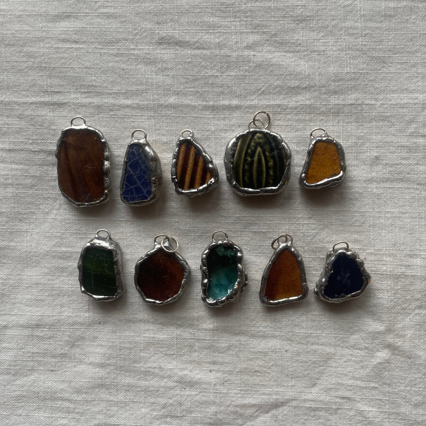Sea pottery and silver pendant dark