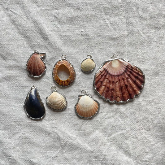 Shell and silver pendant
