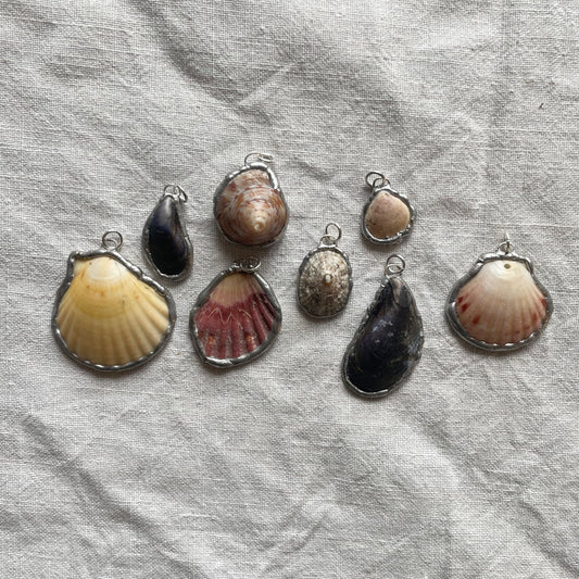Shell and silver pendant