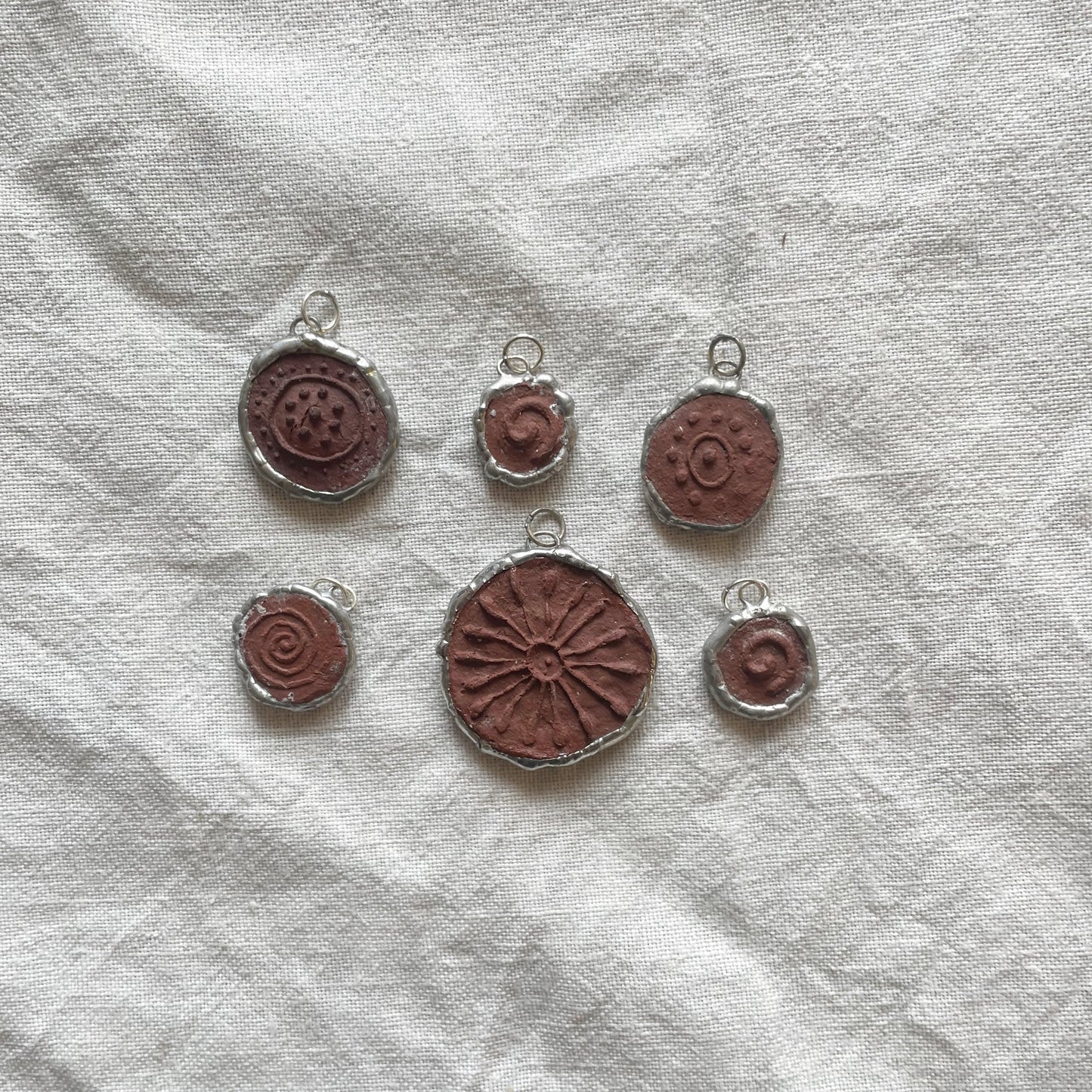 Wild clay and silver pendant