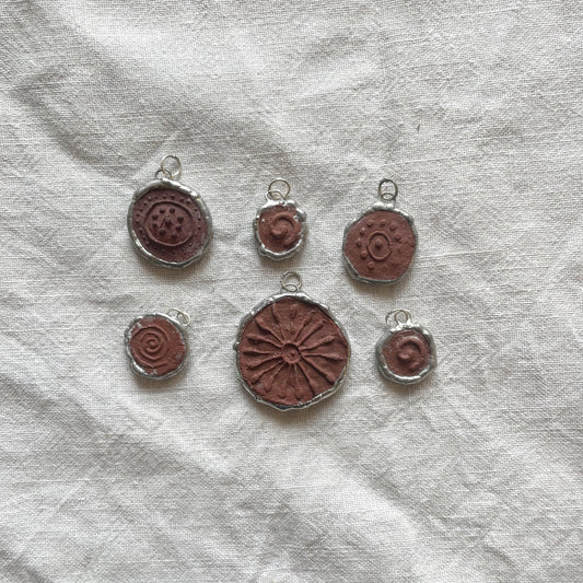 Wild clay and silver pendant