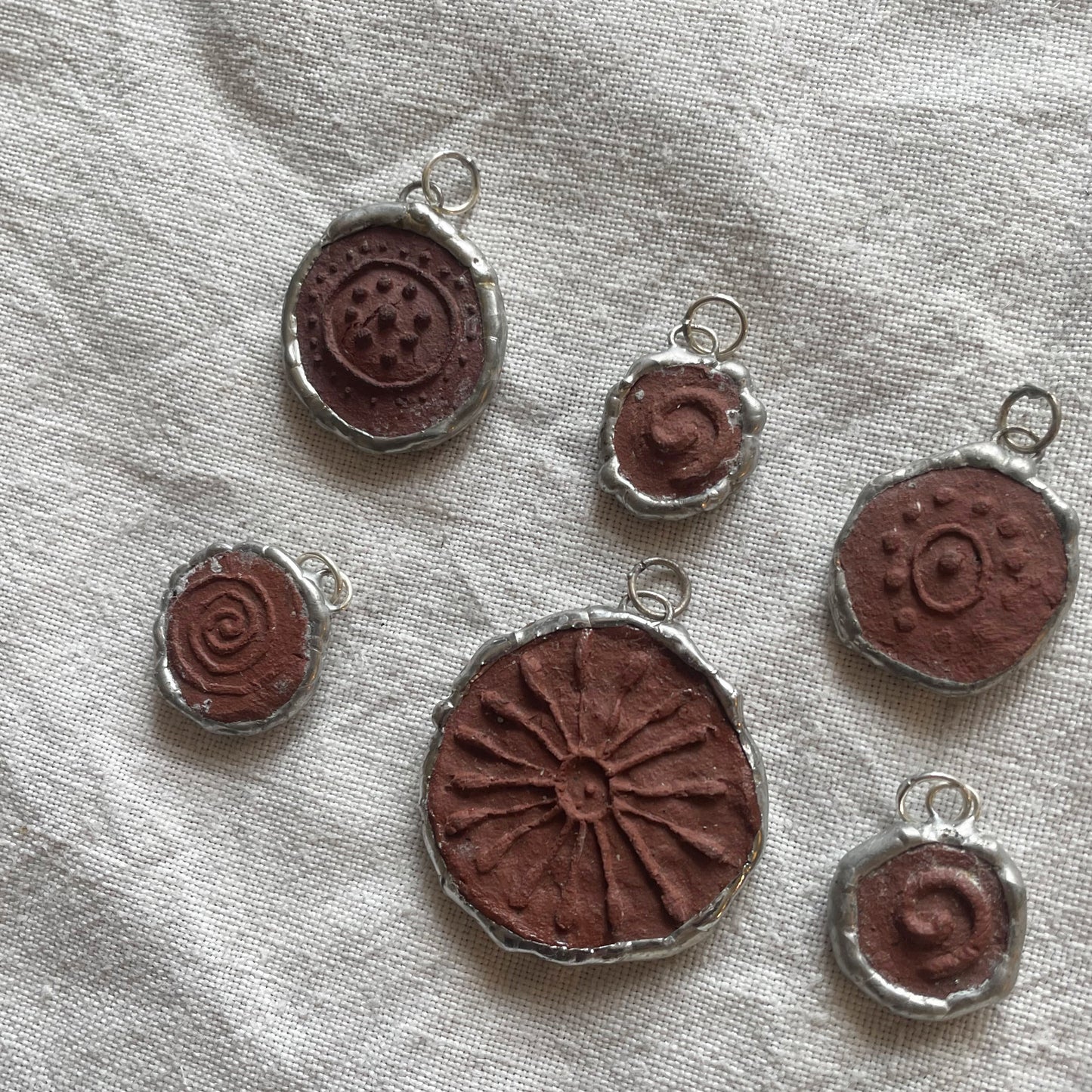 Wild clay and silver pendant